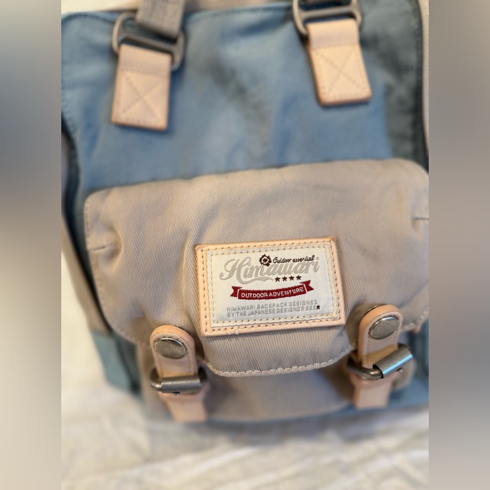 Beige and Blue Travel Backpack